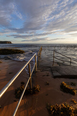 Cloudy sky over Newport rock pool, Sydney, Australia.