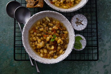 Warming white bean soup with mushrooms