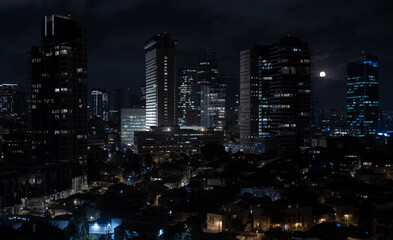 Fototapeta premium Tel Aviv modern office buildings at night. Full moon