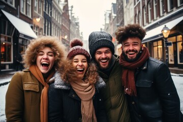 Smiling portrait of young group of student friends enjoying time together on winter city. Young...