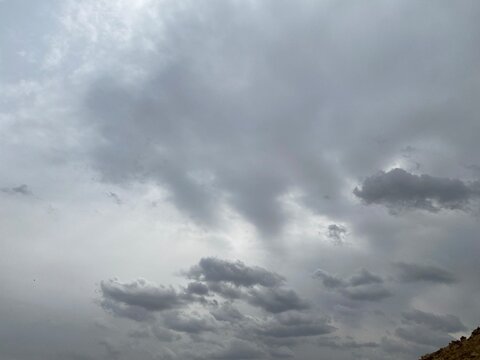 Blue and grey clouds in the overcast sky