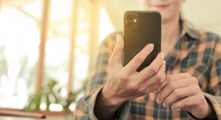 using cell phone hand holding mobile texting message contact us.chatting,search internet information.technology device communication connecting