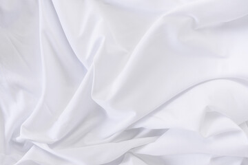 White fabric. luxurious white fabric texture background. Creases of satin, silk and cotton.