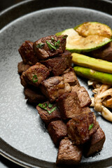 Grilled Beef Steak with Fried Potato, Asparagus, Avocado and Mushrooms