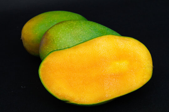 mango harumanis slice isolated on black