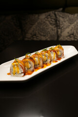 Sushi rolls with eel and teriyaki sauce, close-up.