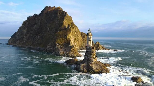 An abandoned lighthouse at sea