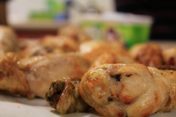 Close-up of the chicken drumsticks in the dish. Food Concept.