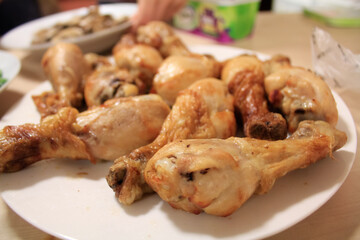 Close-up of the chicken drumsticks in the dish. Food Concept.