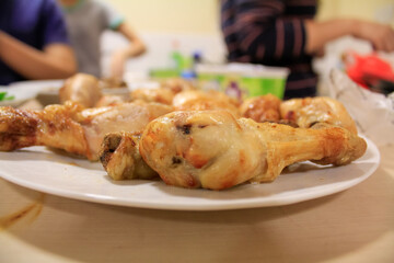 Close-up of the chicken drumsticks in the dish. Food Concept.