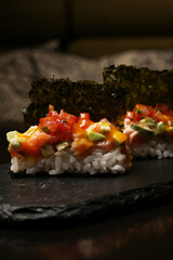 Traditional Japanese sushi set with vegetables and dry seaweed