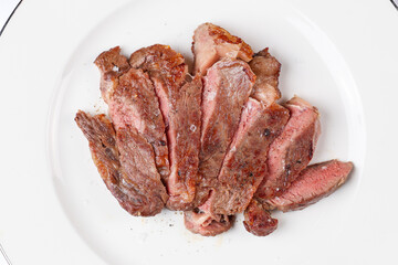 Beef entrecote steak. Close up photo with a dish made of beef entrecote medium rare steak. Barbecue steakhouse grill menu photo. white background