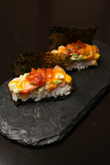 Traditional Japanese sushi set with vegetables and dry seaweed