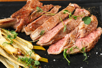 Beef steak. Close up photo with a dish made of beef medium rare steak. Barbecue steakhouse grill menu photo.