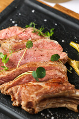 Beef steak. Close up photo with a dish made of beef medium rare steak. Barbecue steakhouse grill menu photo.