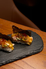 Traditional Japanese sushi set with vegetables and dry seaweed