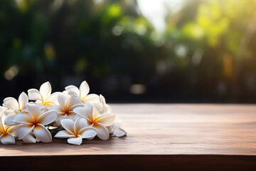 Fototapeta na wymiar A wooden table with a white frangipani flower banner