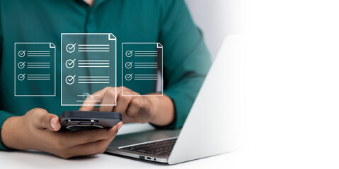 Efficient Electronic Signature Concept, Businessman using phone signs electronic documents on digital documents on virtual tablet. Signing electronic documents for paperless transactions.
