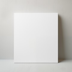 White blank square canvas mockup in minimalist interior.