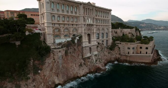 Aerial: Drone Downward Shot Of Oceanographic Museum Of Monaco On Cliff By Waves In Sea - Monte Carlo, Monaco