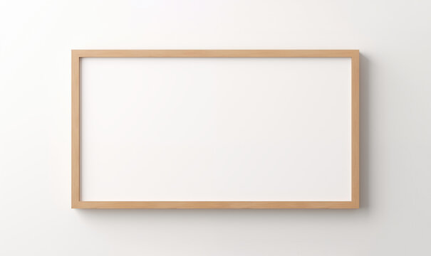 Blank wooden frame on a white wall.