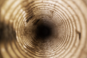 inside view of dirty corrugated drainage pipe