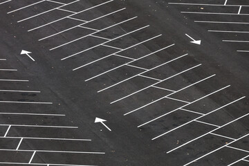 Empty parking space. Aerial photo with an asphalt parking lot in front of a shopping center and...