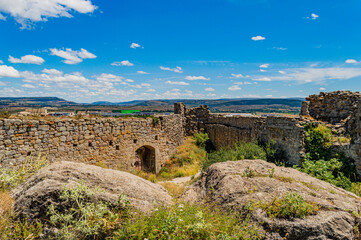 Fototapeta premium medieval castle ruins in the countryside with blue sky