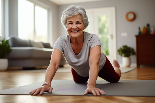 Mature Woman Staying Fit At Home, Engaging In Health-promoting Exercise And Stretching