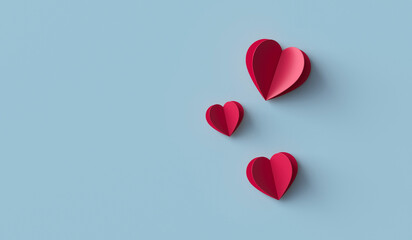 Red paper hearts on blue background