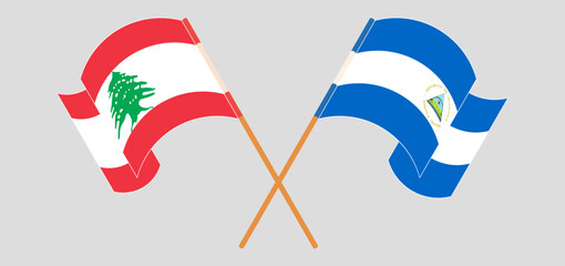 Fototapeta premium Crossed and waving flags of the Lebanon and Nicaragua