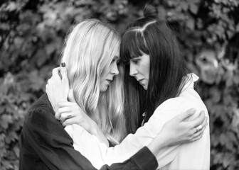Fashion girls twins posing in nature