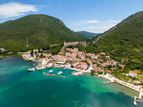 Croatia,Dubrovnik-NeretvaCounty, Mali Stron, Aerial view of coastal village and surrounding mountains in summer