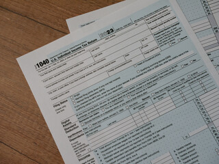 W-2 and 1040 Tax Form. Tax Payment Concept. Filing Taxes Document on Table in Office. Individual Income Tax Return