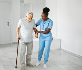 nurse senior man home care patient elderly health help woman retirement caregiver assistance nursing helping holding hug old walking cane carer reaching out