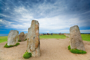 Ales Stenar - megalithic monument in Scania in southern Sweden. Unrecognizable people. - 688024321