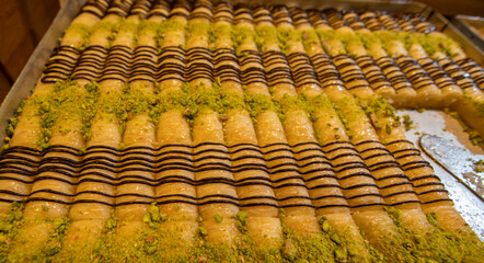 Fresh pistachio wrap baklava on tray