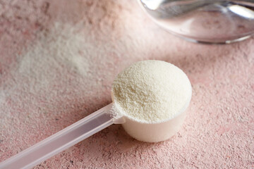 Collagen powder in a plastic measuring scoop