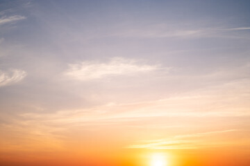 Beautiful of luxury soft gradient orange gold clouds and sunlight on the blue sky perfect for the background, take in everning,Twilight