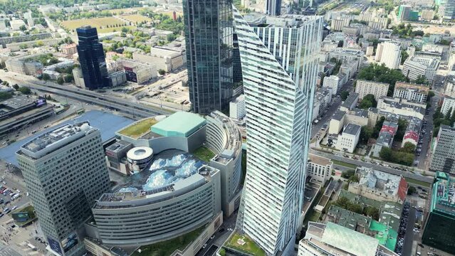 Modern business districtcity glass skyscrapers in the big city top view Warszawa, Poland. Establishing Aerial Panoramic View of Warsaw City Centre, Poland, Europe. Cityscape with modern skyscrapers.