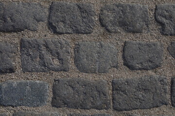 Textured paving brick wall background