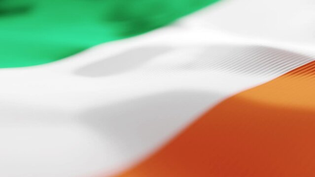 Silk flag of Ireland. Wavy background of the Irish flag waving in the wind. Symbol of national patriotism and independence. Footage in Ultra HD 4K. 