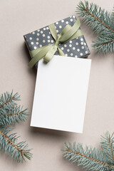 Christmas or New Year greeting card mockup with decorated gift box