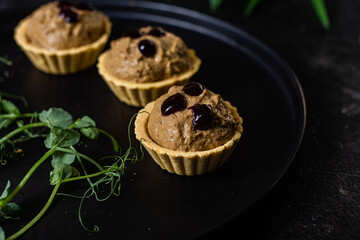 Dough tartlets with pate, mushrooms and salmon