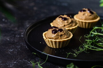 Dough tartlets with pate, mushrooms and salmon