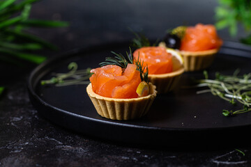 Dough tartlets with pate, mushrooms and salmon