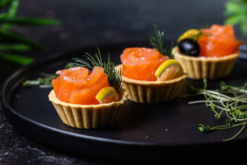 Dough tartlets with pate, mushrooms and salmon