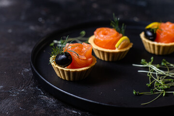 Dough tartlets with pate, mushrooms and salmon