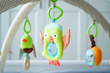 Green owl toy hanging on playmobile
