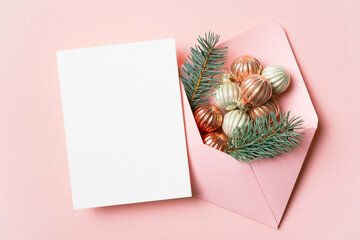 Christmas card mockup with pink envelope, blank card with copy space